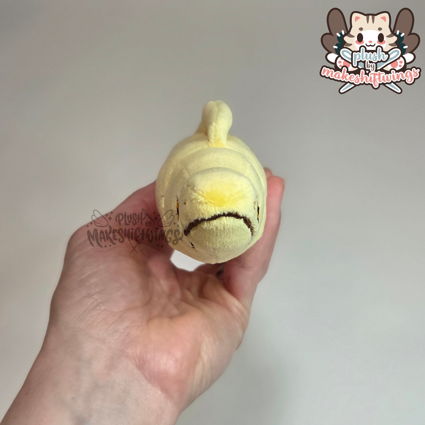 Banana eel plush (mochi, embroidered eyes)