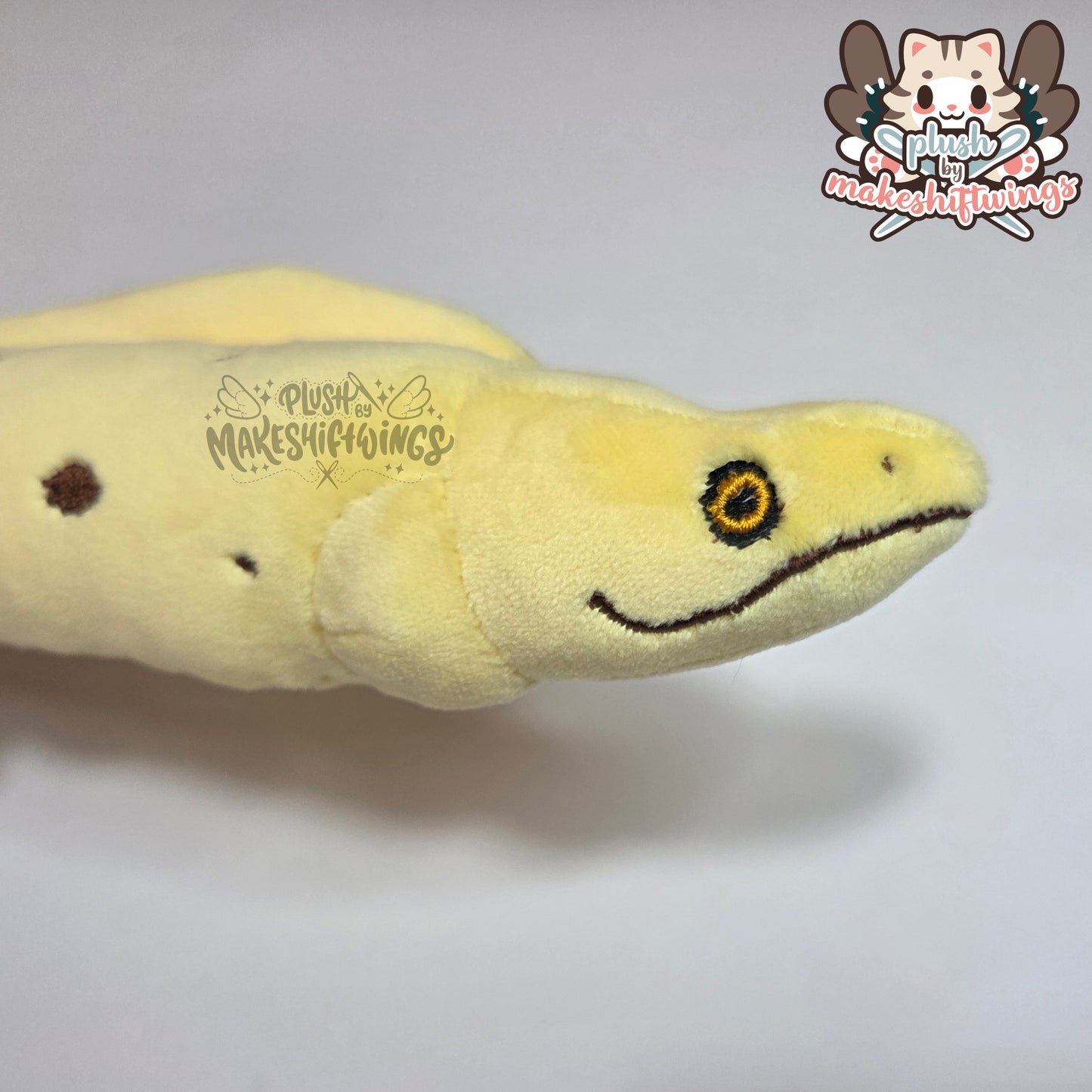 Banana eel plush (mochi, embroidered eyes)