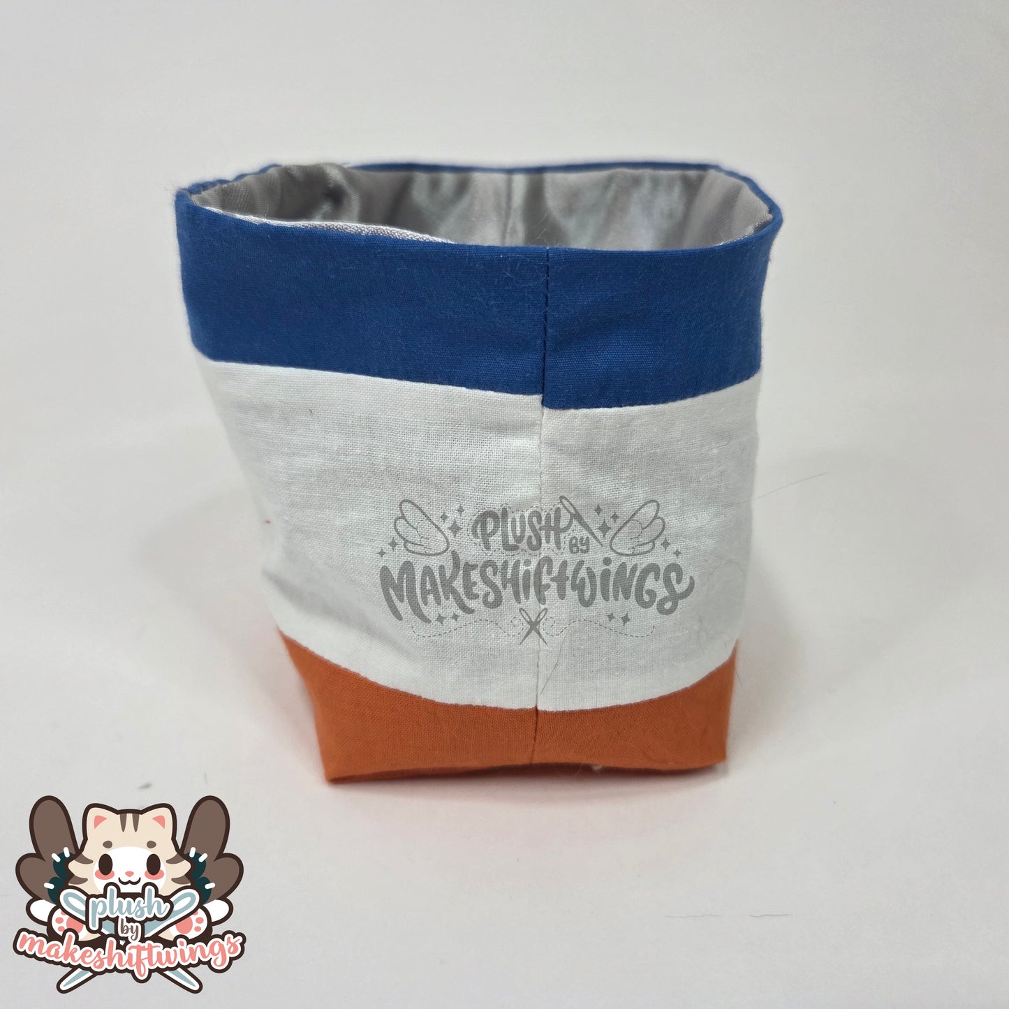 Raccoon in a chip bag (embroidered eyes)