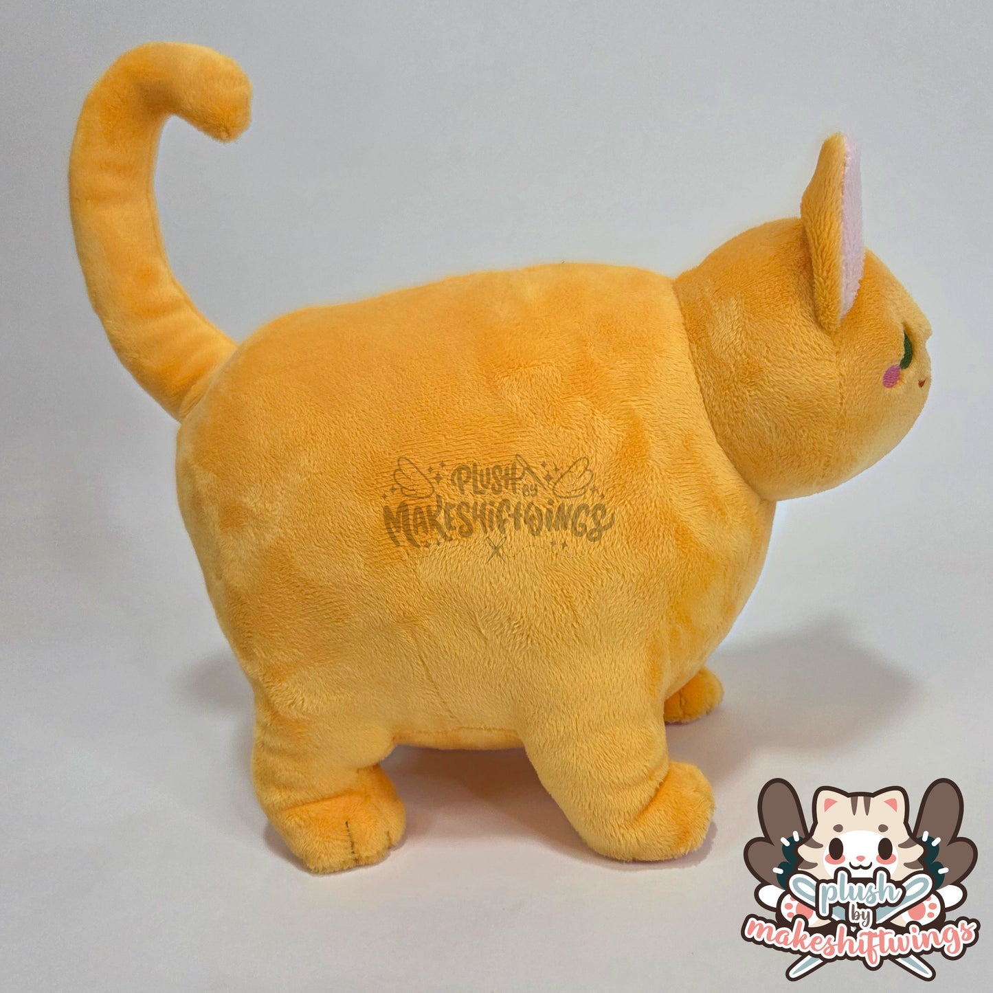 Orange fat cat in a sweater