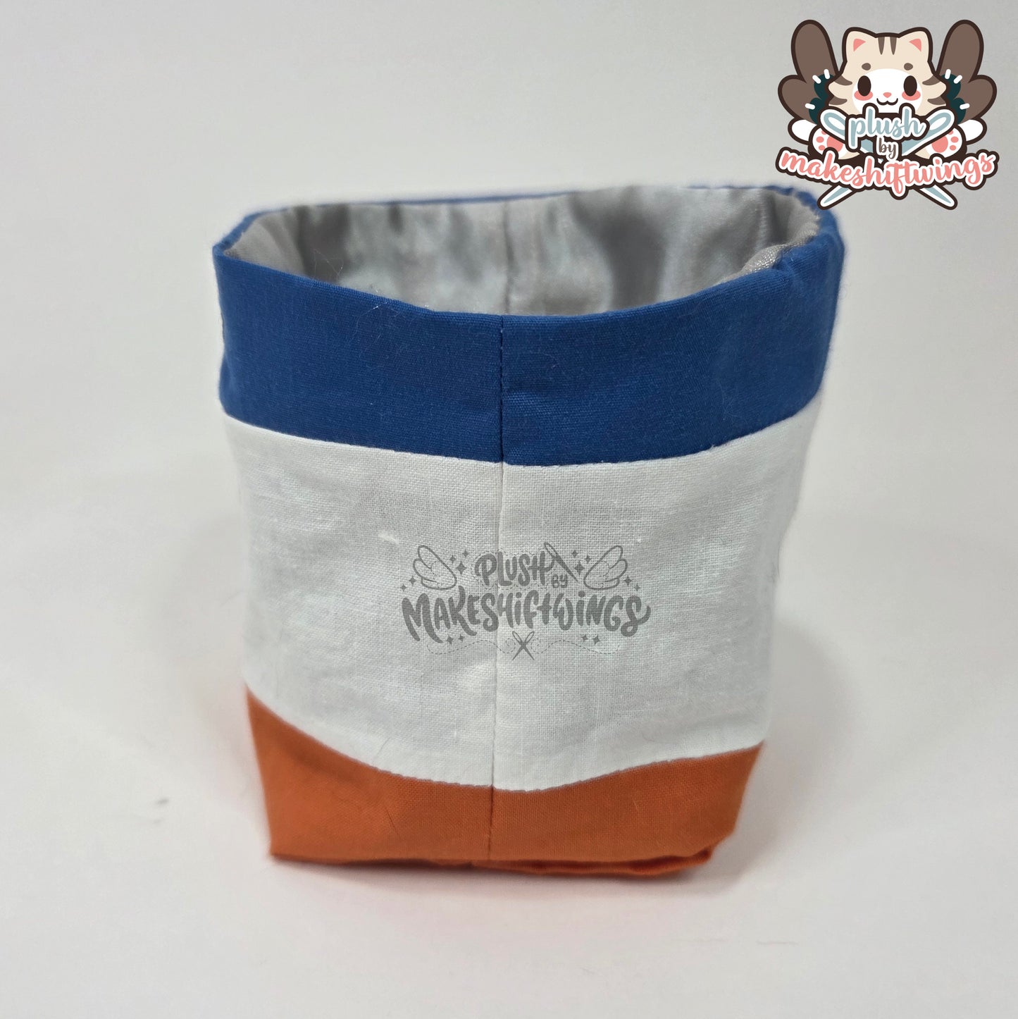 Raccoon in a chip bag (embroidered eyes)
